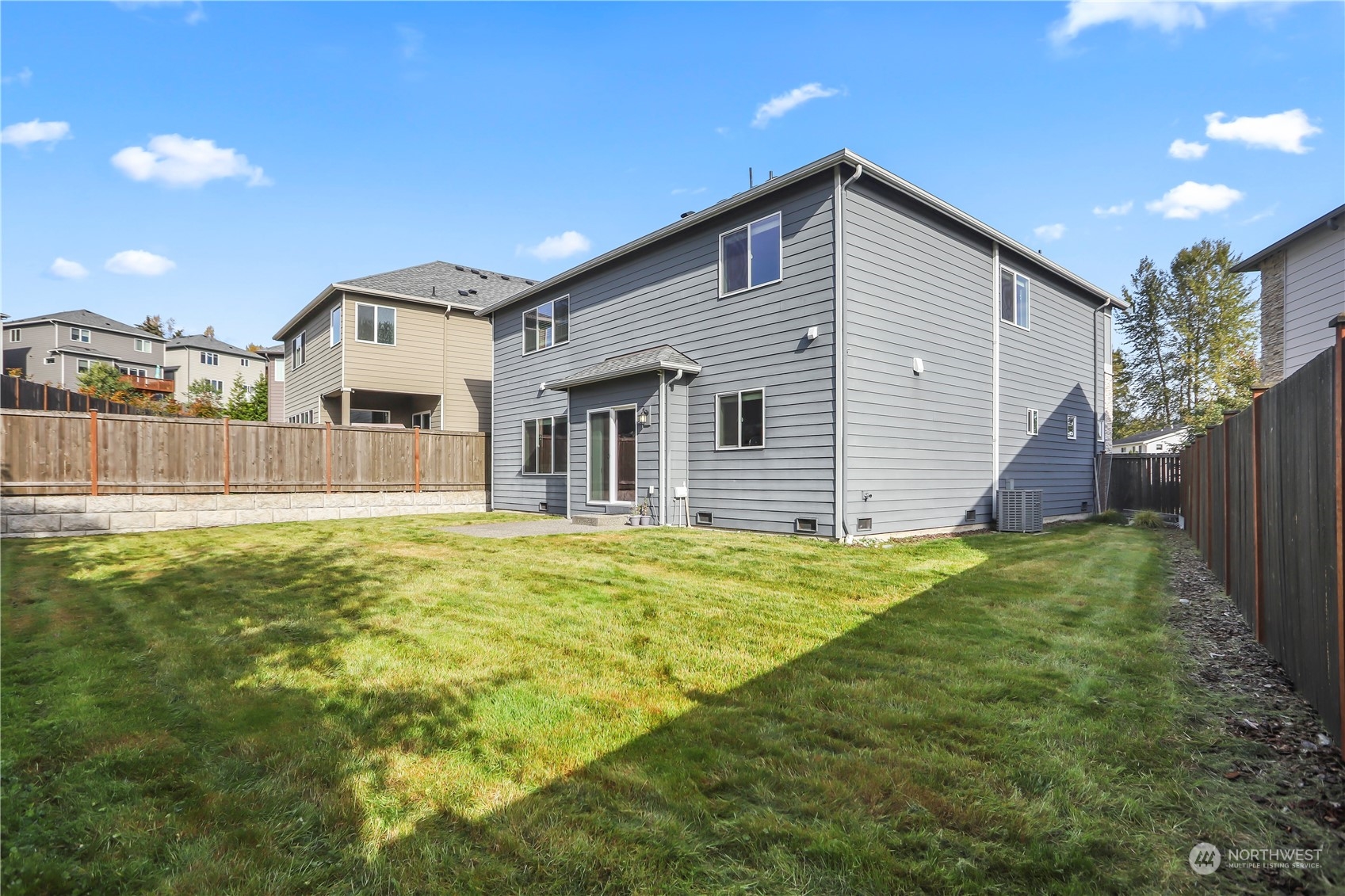 1224 198th Place Southeast Bothell, WA 98012 - Photo 30 of 38 a front view of a house with a yard