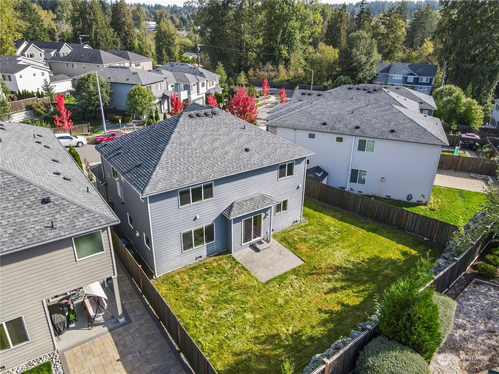1224 198th Place Southeast Bothell, WA 98012 - Photo 31 of 38 an aerial view of a house with swimming pool and large trees