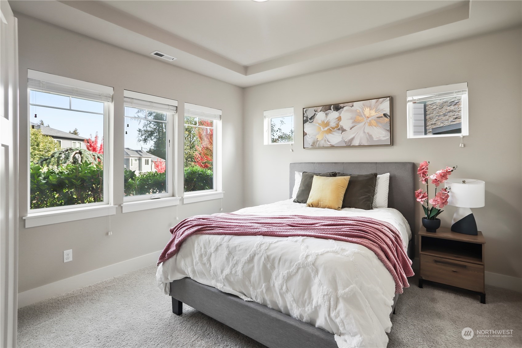 1224 198th Place Southeast Bothell, WA 98012 - Photo 5 of 38 a bed sitting in a bedroom next to a window