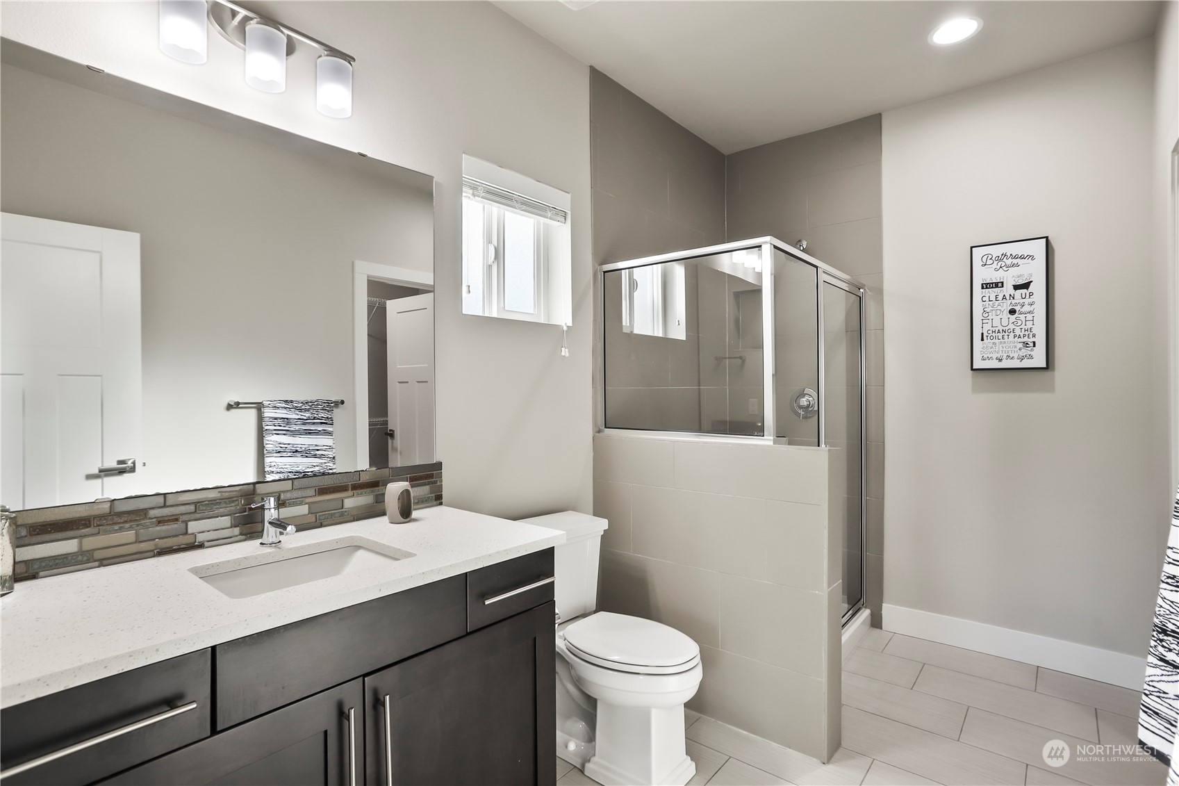 1224 198th Place Southeast Bothell, WA 98012 - Photo 6 of 38 a bathroom with a sink toilet and mirror