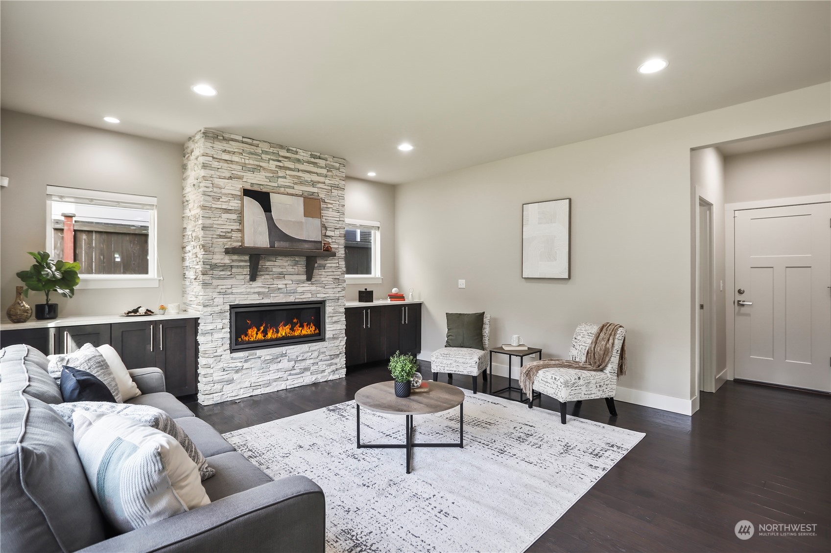 1224 198th Place Southeast Bothell, WA 98012 - Photo 9 of 38 a living room with furniture and a fireplace