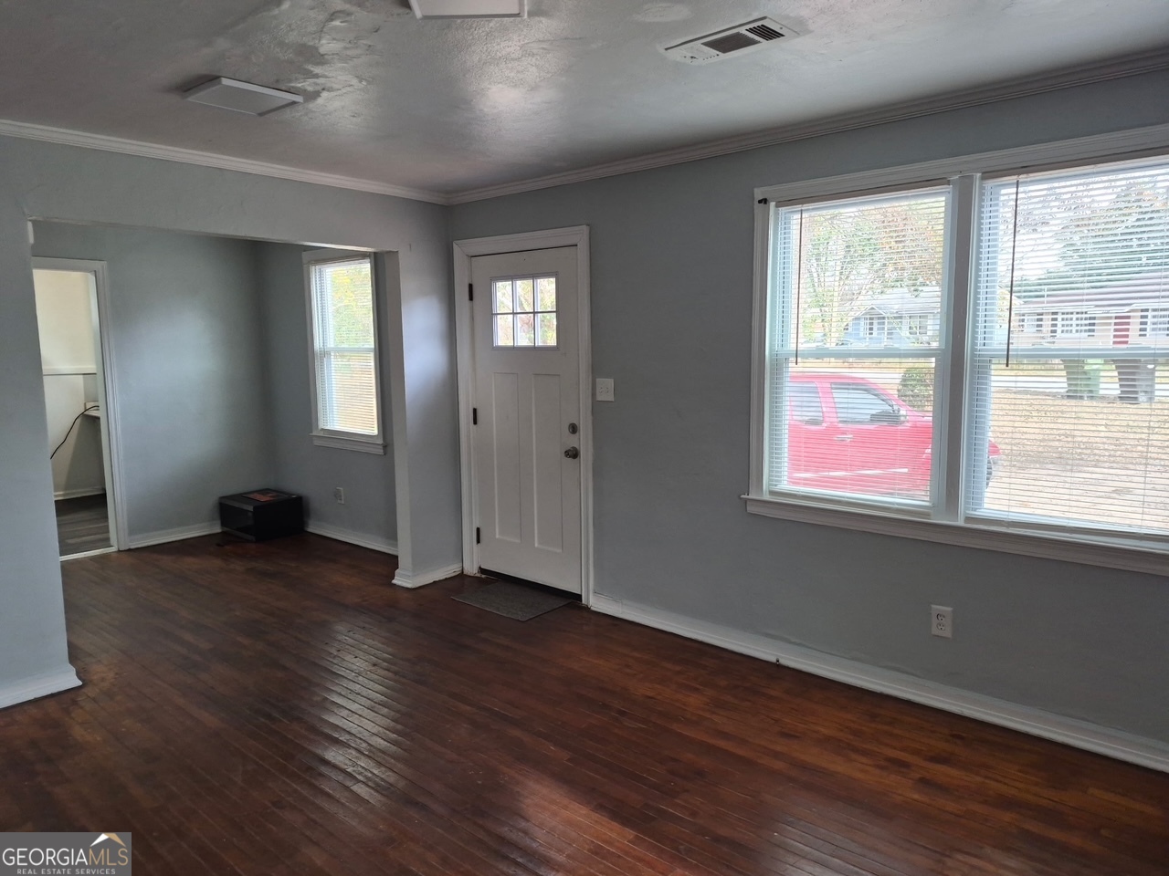 2241 Bruce Avenue Columbus, GA 31903 - Photo 11 of 15 an empty room with wooden floor and windows