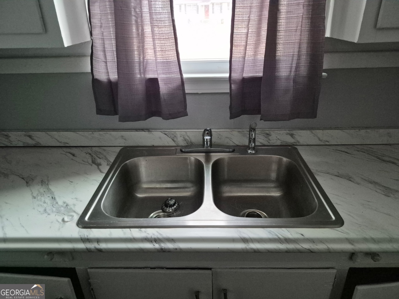 2241 Bruce Avenue Columbus, GA 31903 - Photo 8 of 15 a close view of sink and tap