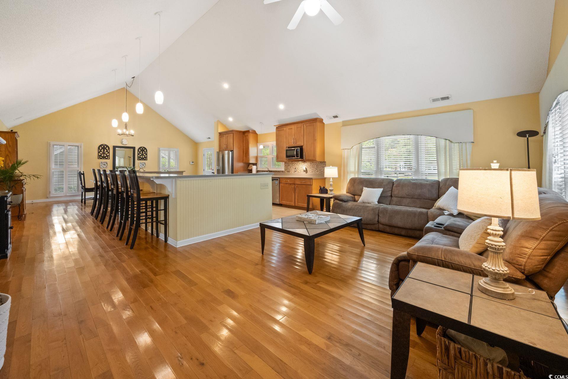 33 Great Lakes Road Pawleys Island, SC 29585 - Photo 11 of 30 Living room featuring ceiling fan with notable cha