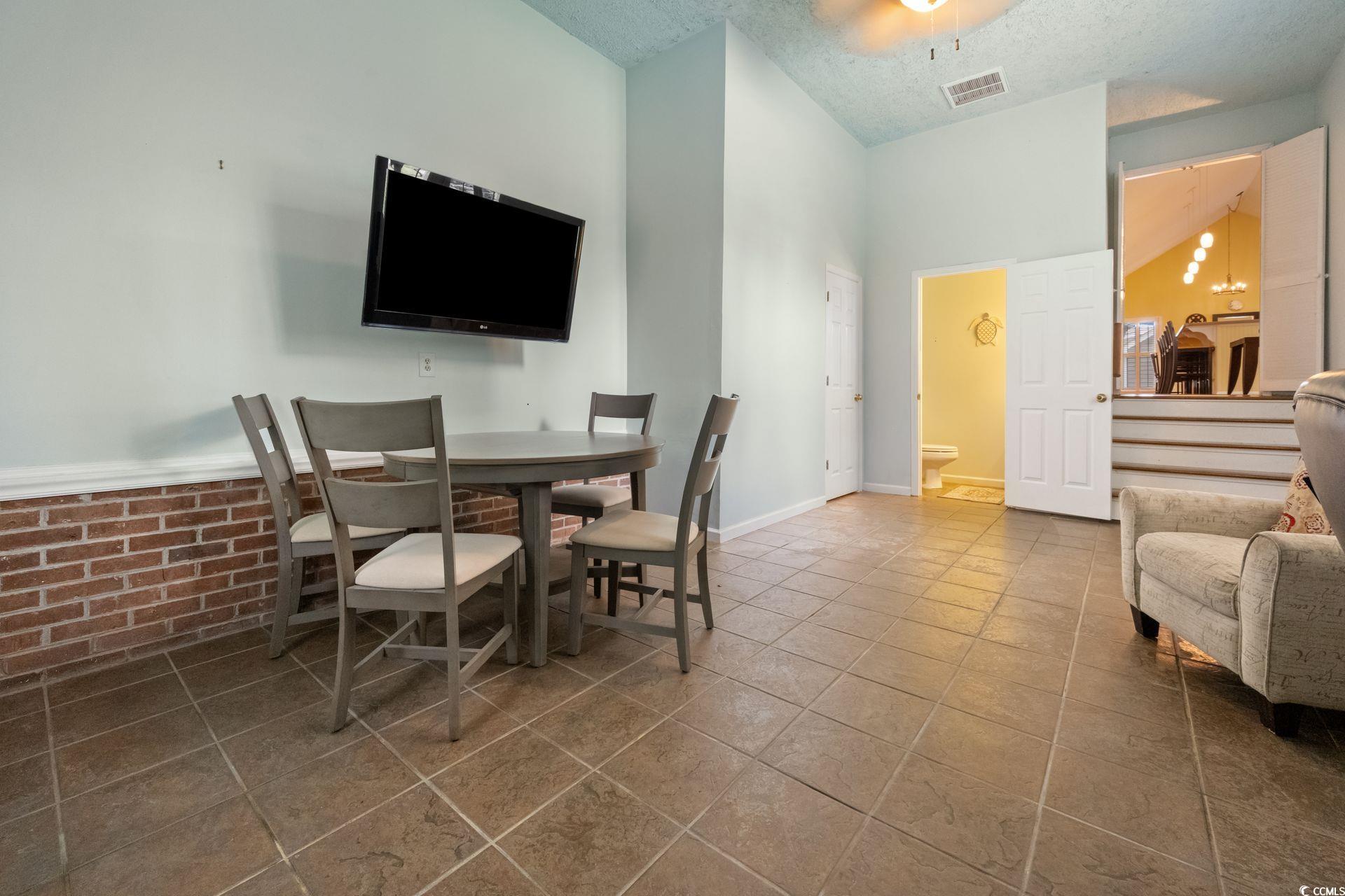 33 Great Lakes Road Pawleys Island, SC 29585 - Photo 13 of 30 Bonus space featuring tile patterned floors, a tex