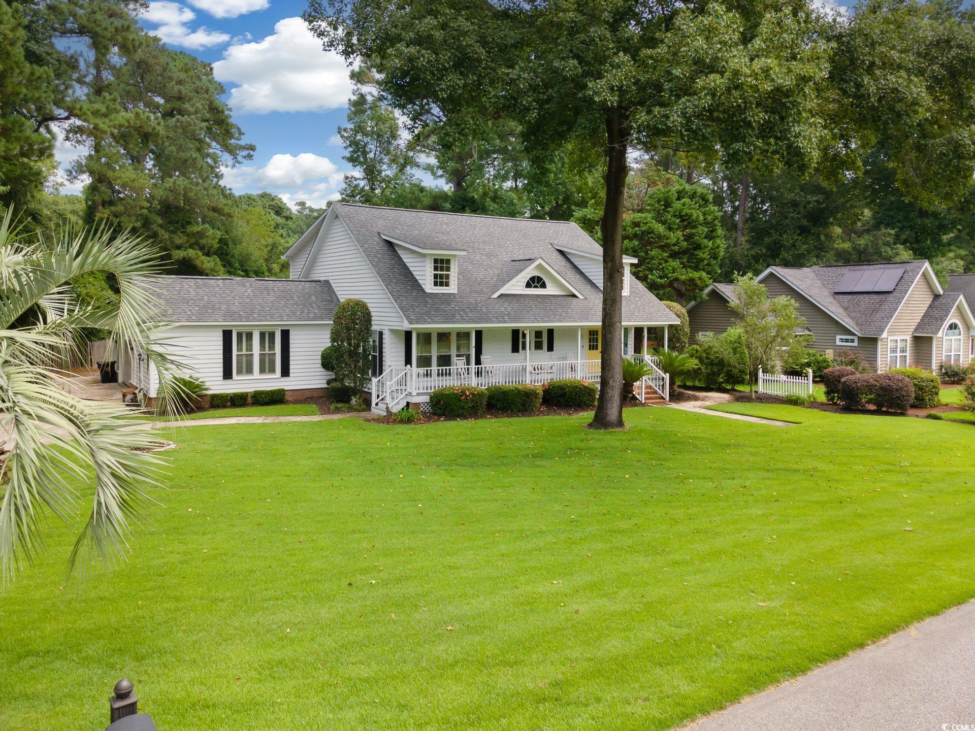 33 Great Lakes Road Pawleys Island, SC 29585 - Photo 2 of 30 View of front of property with a front yard and co