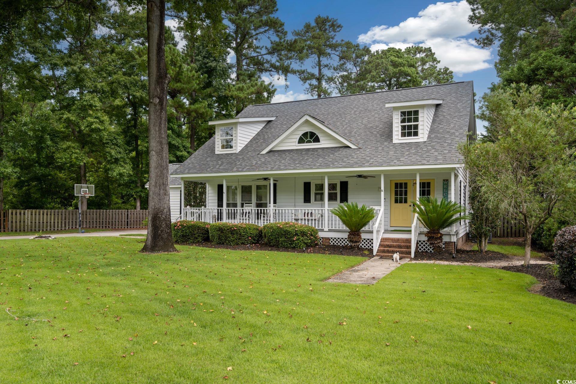 33 Great Lakes Road Pawleys Island, SC 29585 - Photo 3 of 30 Lowcountry home featuring a front yard and covered