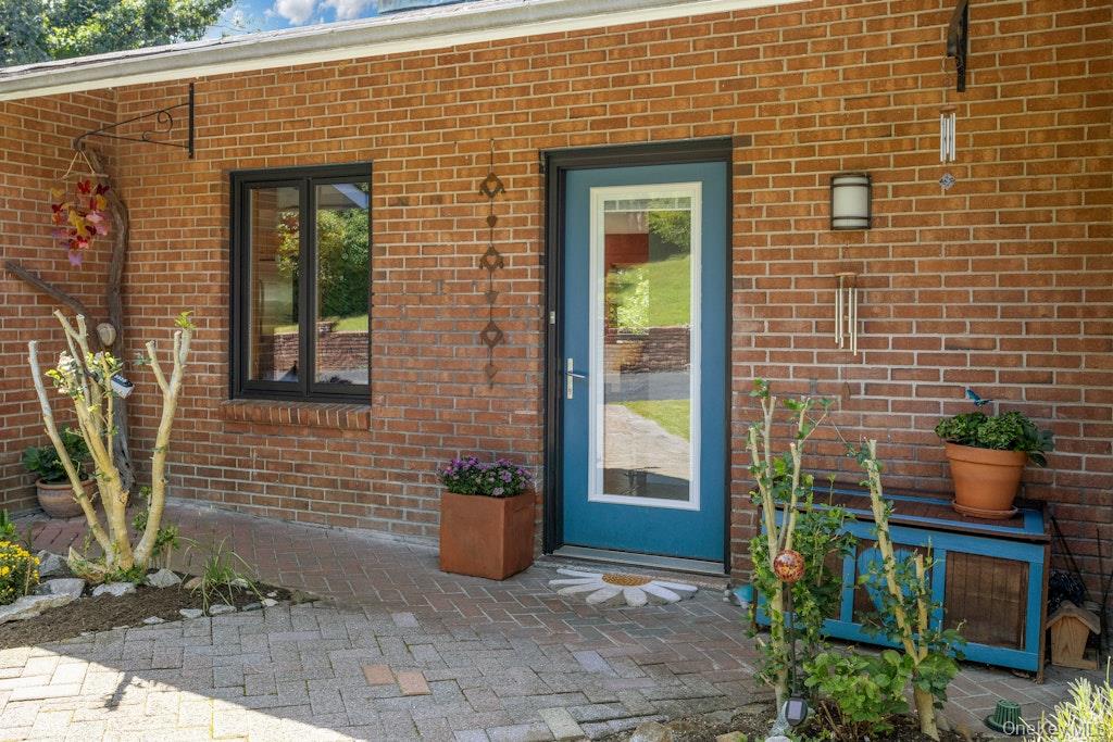 2 Buttermilk Falls Road Nyack, NY 10960 - Photo 2 of 41 a view of a door and chair and table in the balcony