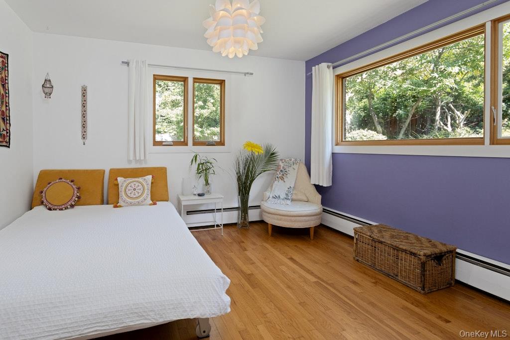 2 Buttermilk Falls Road Nyack, NY 10960 - Photo 21 of 41 a bedroom with a bed and wooden floor