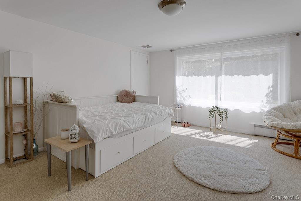 2 Buttermilk Falls Road Nyack, NY 10960 - Photo 24 of 41 a bedroom with a bed a table and chair