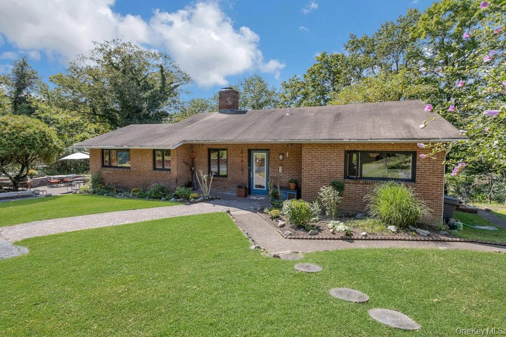 2 Buttermilk Falls Road Nyack, NY 10960 - Photo 28 of 41 a front view of a house with a garden and porch