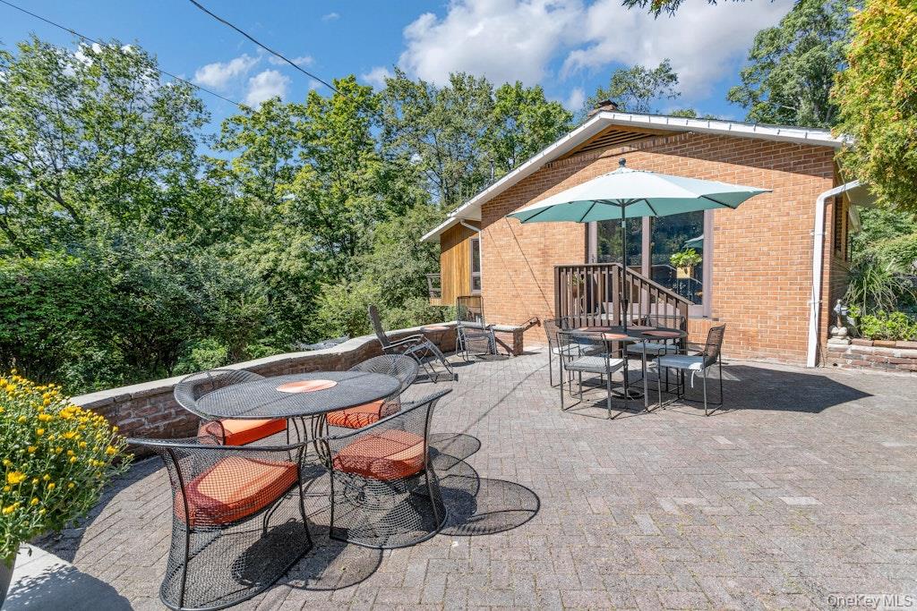 2 Buttermilk Falls Road Nyack, NY 10960 - Photo 35 of 41 a view of patio with chairs and table under an umbrella
