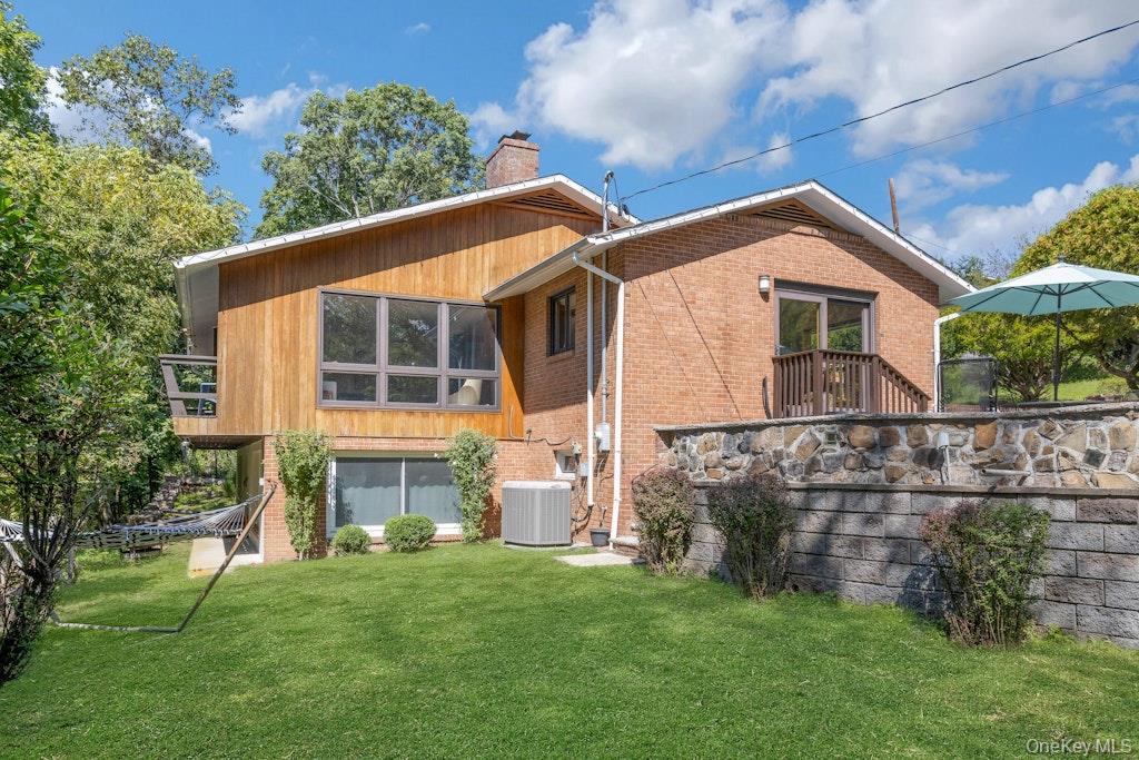 2 Buttermilk Falls Road Nyack, NY 10960 - Photo 37 of 41 a front view of a house with a garden