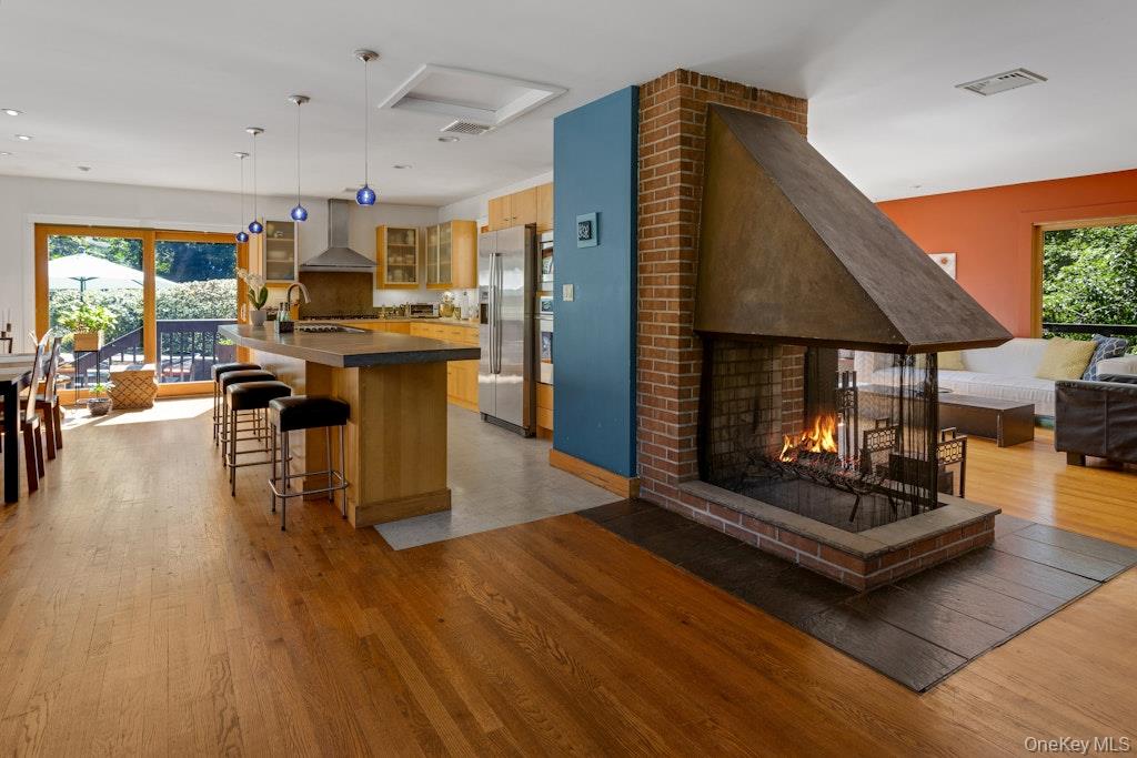 2 Buttermilk Falls Road Nyack, NY 10960 - Photo 4 of 41 a living room with furniture a wooden floor and a fireplace