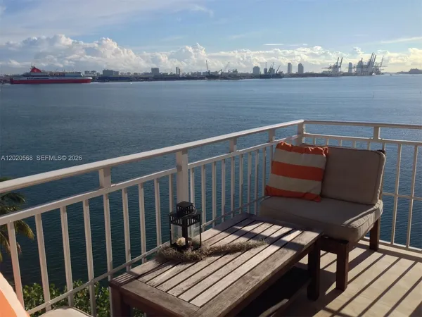 a view of a balcony with an outdoor seating
