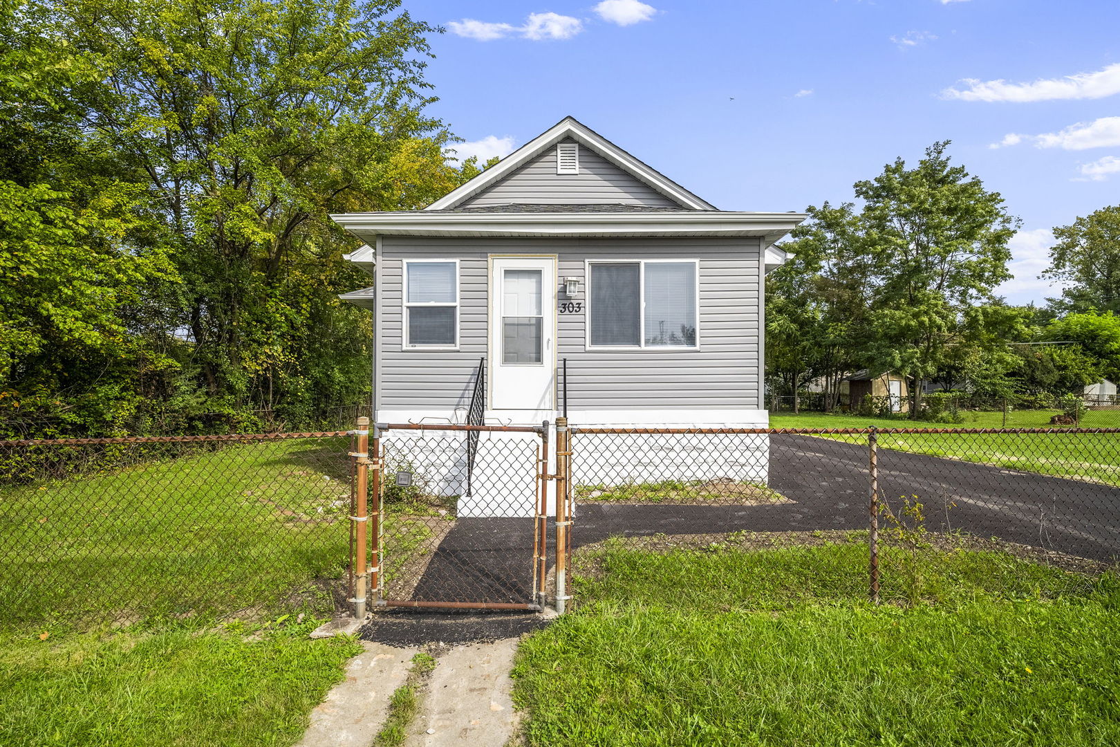 303 Princeton Street Lockport, IL 60441 - Photo 1 of 16 a front view of a house with a yard