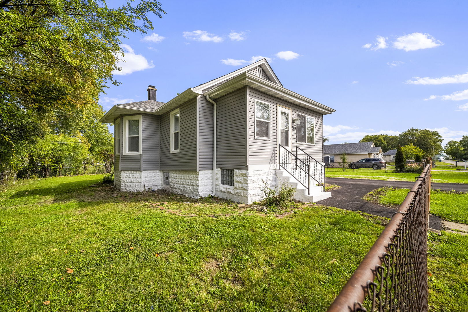 303 Princeton Street Lockport, IL 60441 - Photo 14 of 16 a front view of house with yard and green space