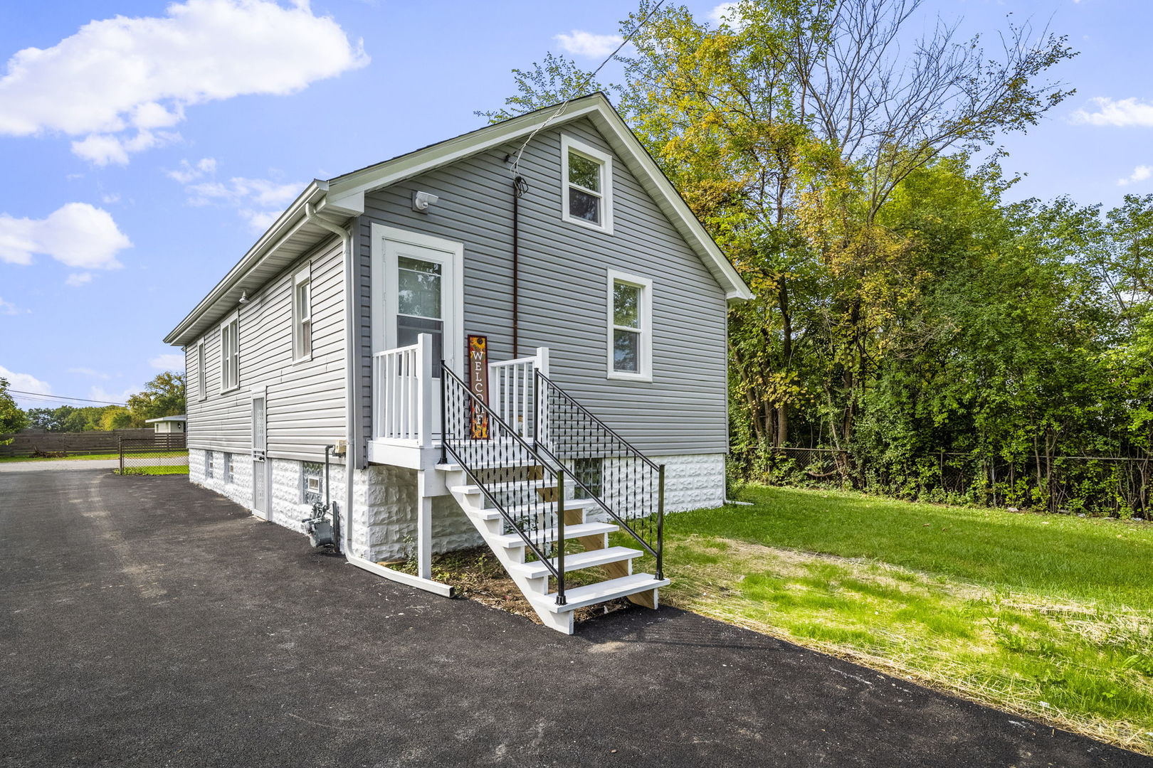 303 Princeton Street Lockport, IL 60441 - Photo 15 of 16 a view of a house with a yard