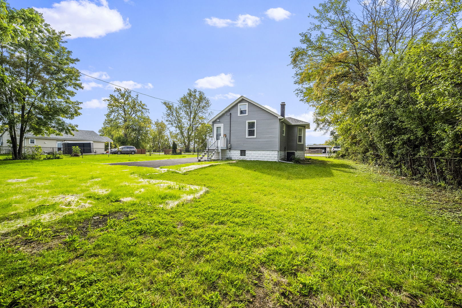 303 Princeton Street Lockport, IL 60441 - Photo 16 of 16 a view of a house with a big yard