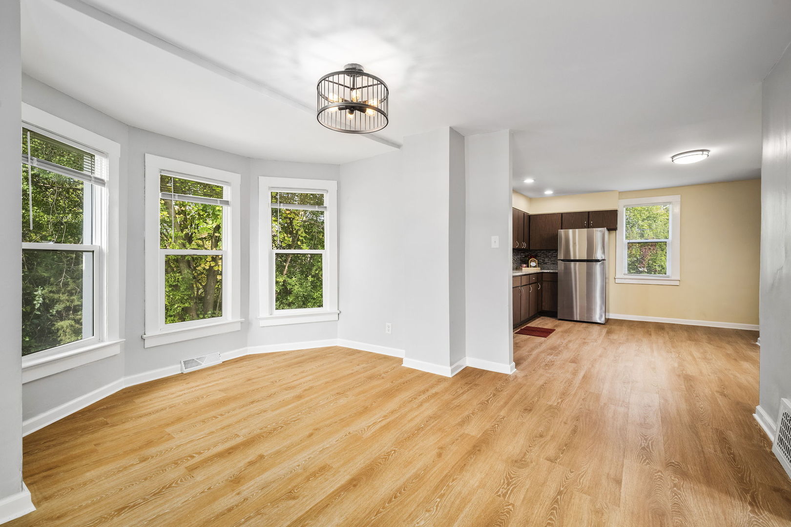 303 Princeton Street Lockport, IL 60441 - Photo 5 of 16 a view of empty room with wooden floor and fan