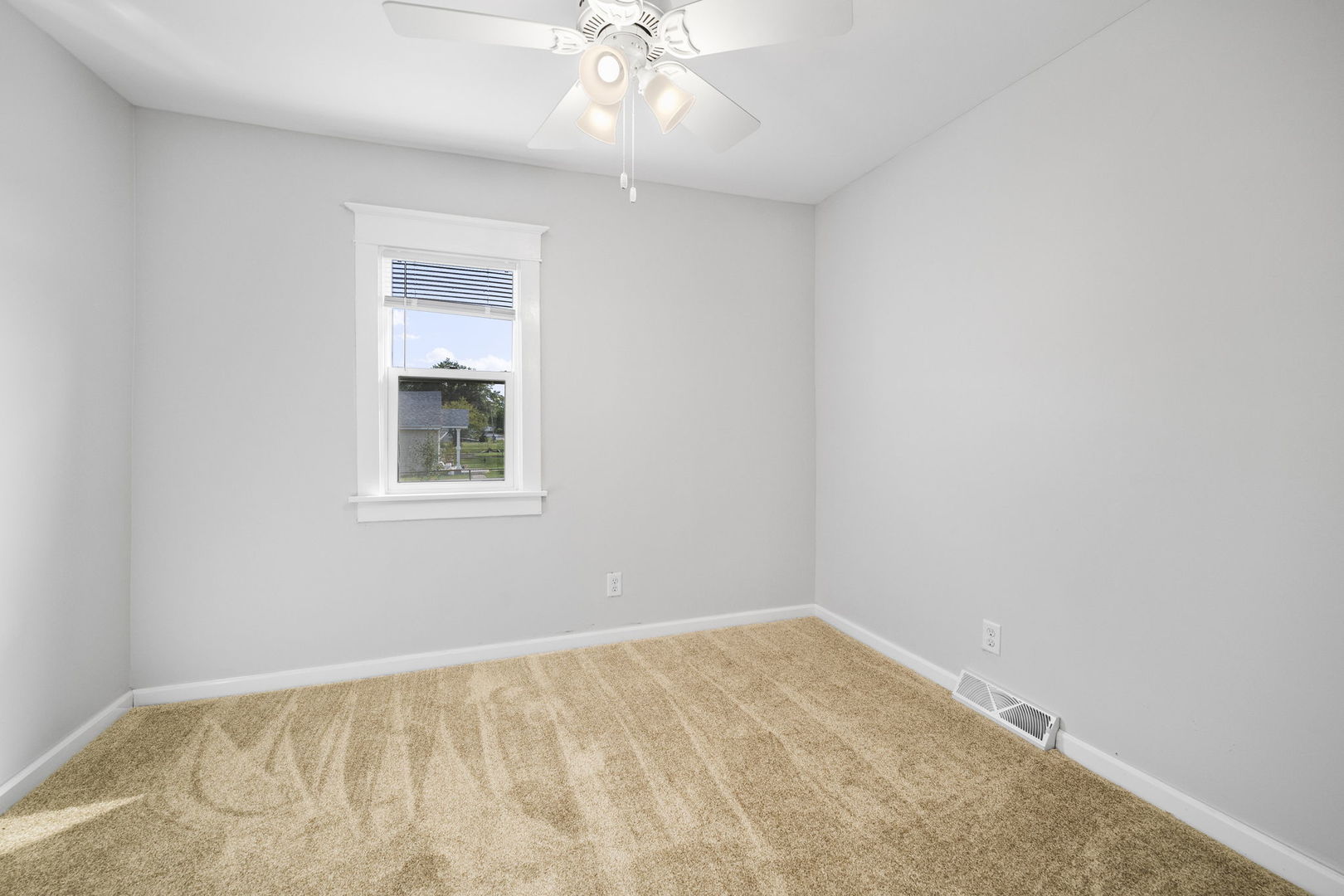 303 Princeton Street Lockport, IL 60441 - Photo 9 of 16 an empty room with a window