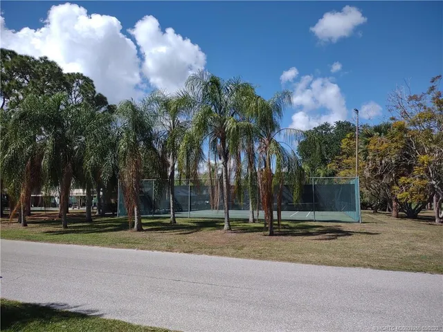 a view of a playground with basketball court