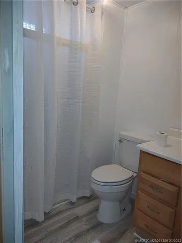a bathroom with a toilet and a sink