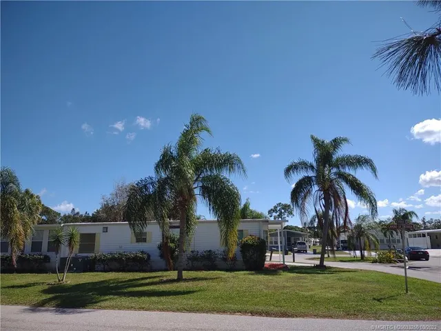 front view of house with yard and ocean view
