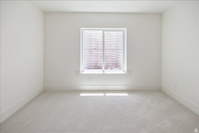 952 Mathilda Drive, Unit 156 Saratoga Springs, UT 84045 - Photo 23 of 25 Basement Bedroom #2 Bright interior room featuring a window with a white frame, light-colored carpeting, white baseboards, and neutral wall tones