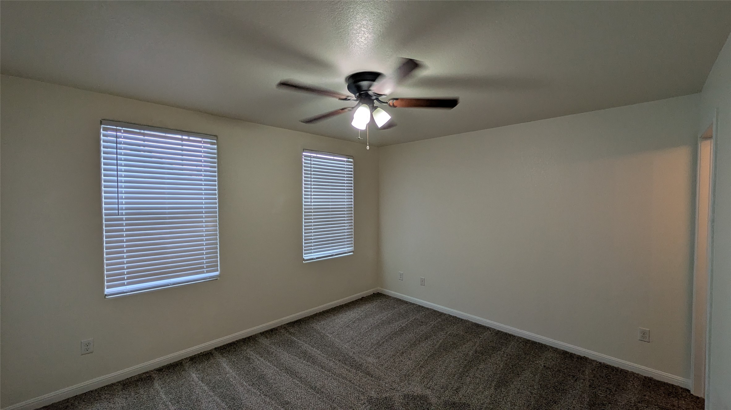 262 Trestle Tree San Marcos, TX 78666 - Photo 11 of 18 a view of a livingroom with a ceiling fan and window