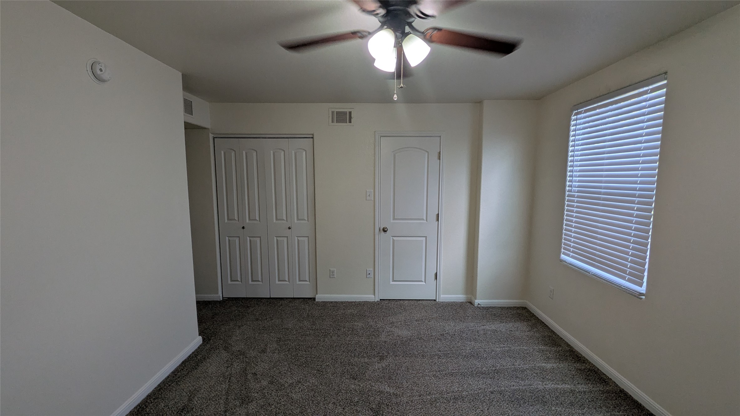 262 Trestle Tree San Marcos, TX 78666 - Photo 12 of 18 en empty room with windows and fan