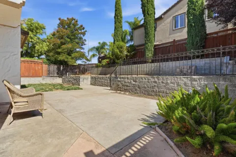 a view of a backyard with a patio