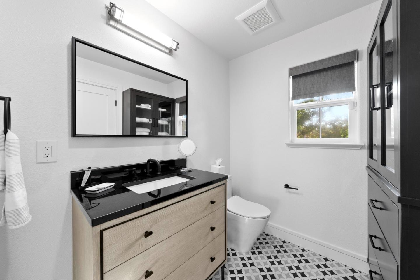 120 Harrison Avenue Campbell, CA 95008 - Photo 28 of 48 a bathroom with a toilet a sink and mirror