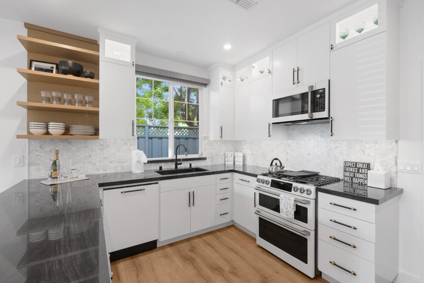 120 Harrison Avenue Campbell, CA 95008 - Photo 4 of 48 a kitchen with stainless steel appliances a sink stove and microwave
