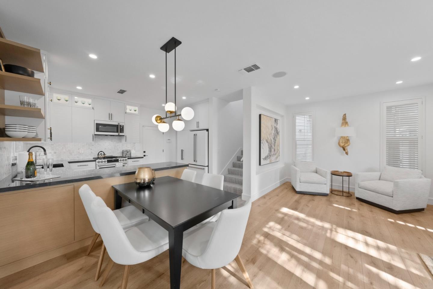 120 Harrison Avenue Campbell, CA 95008 - Photo 5 of 48 a living room with furniture a chandelier and a dining table
