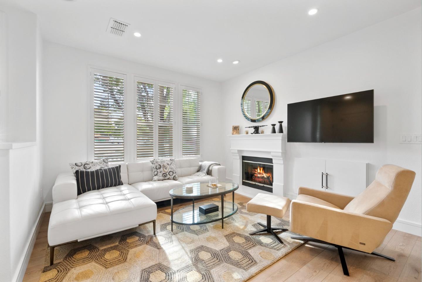 120 Harrison Avenue Campbell, CA 95008 - Photo 9 of 48 a living room with furniture a fireplace and a flat screen tv