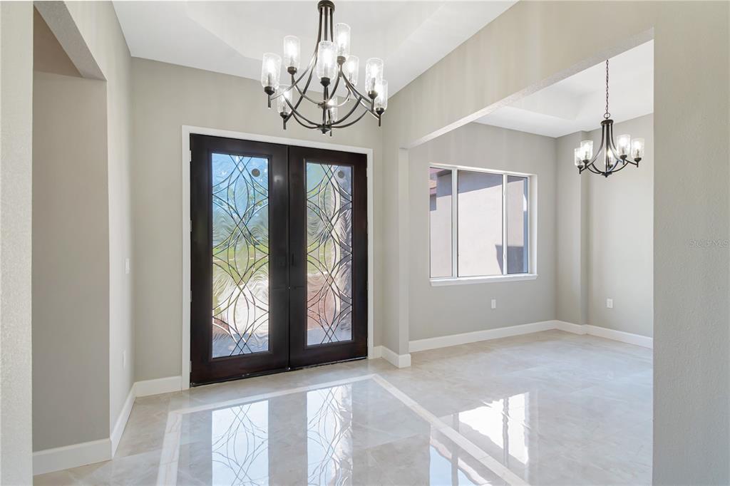 4869 Northwest 101st St Road Ocala, FL 34482 - Photo 5 of 48 gorgeous front doors, front entry and dining room