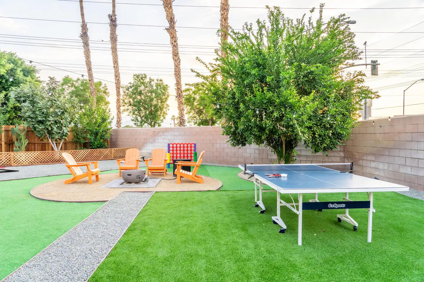 81032 Red Bluff Road Indio, CA 92201 - Photo 4 of 33 a view of a backyard with table and chairs and potted plants