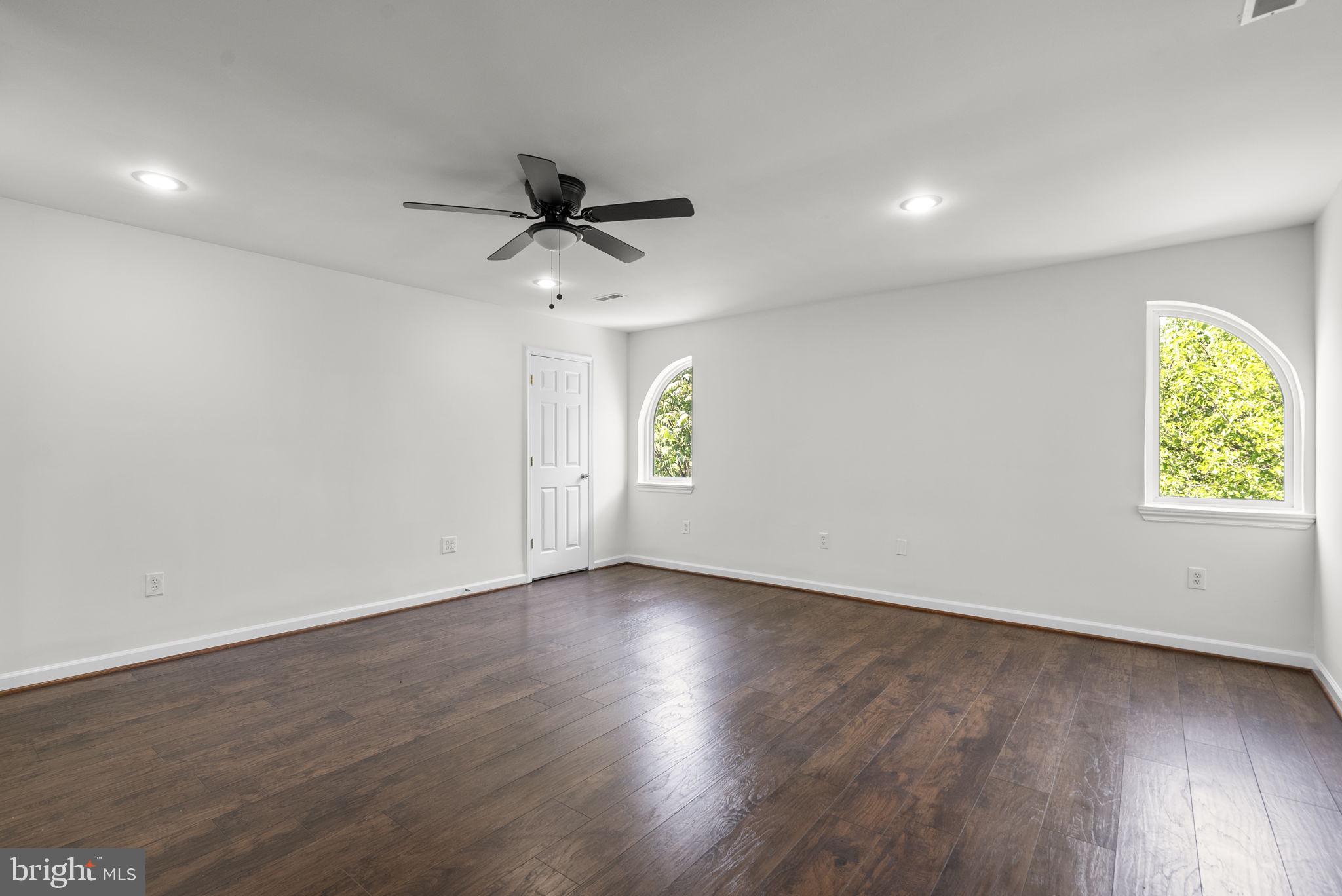 24000 Clarksburg Road Clarksburg, MD 20871 - Photo 23 of 60 an empty room with wooden floor and windows