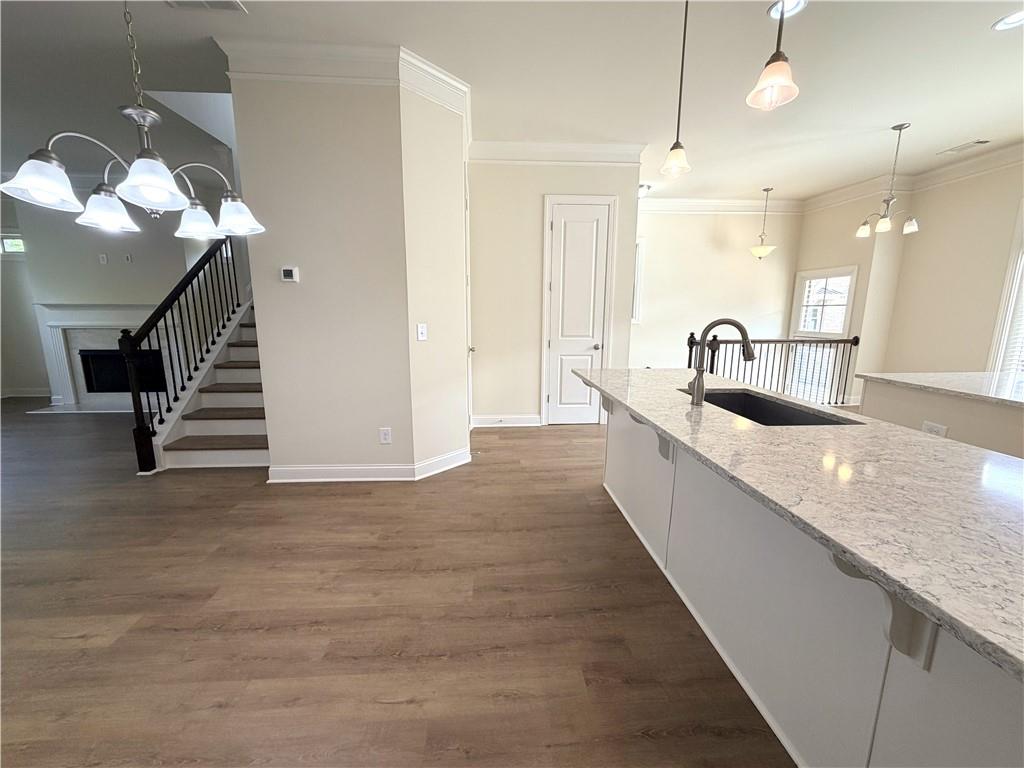 1980 Raven Way Chamblee, GA 30341 - Photo 12 of 51 a large kitchen with kitchen island a sink stainless steel appliances and a counter top space