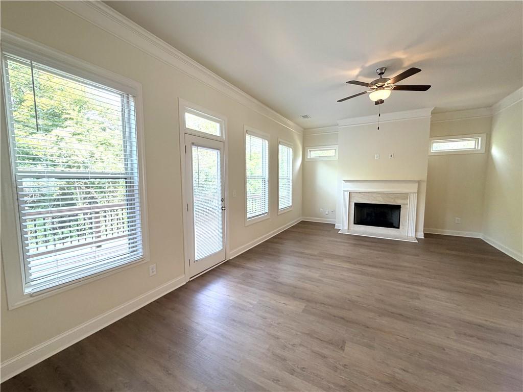 1980 Raven Way Chamblee, GA 30341 - Photo 15 of 51 a view of an empty room with a window and wooden floor