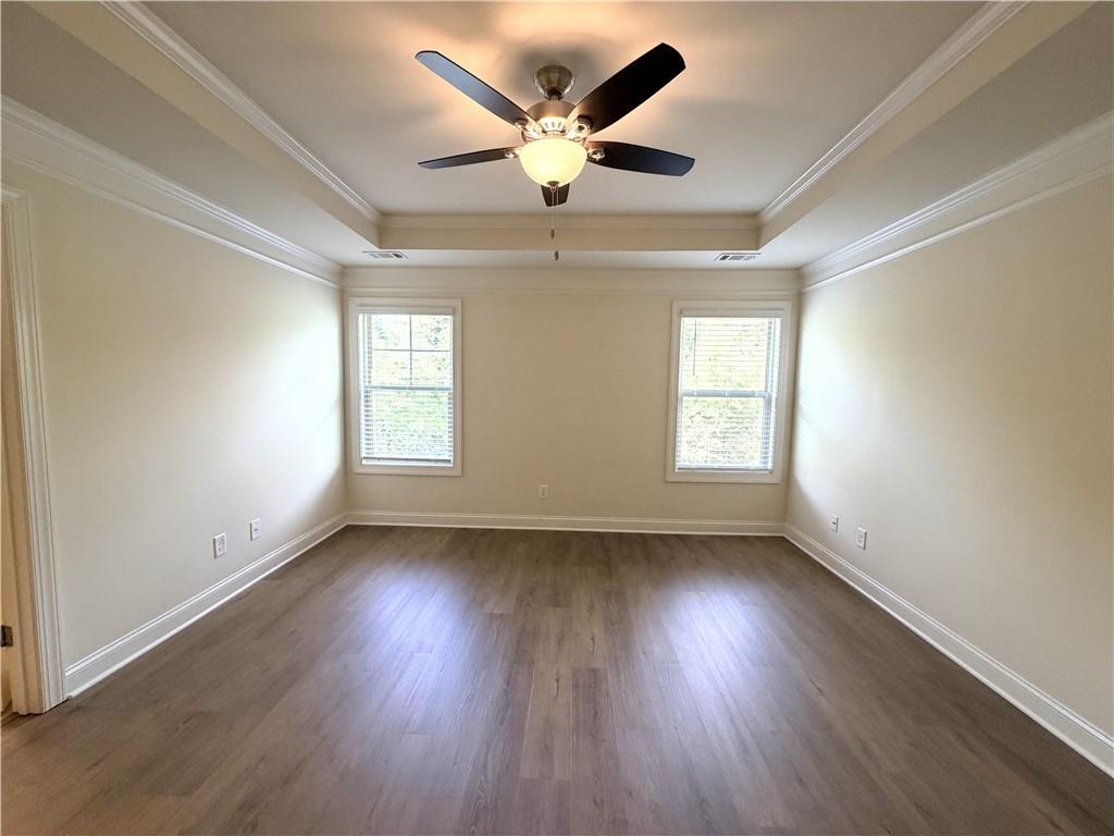 1980 Raven Way Chamblee, GA 30341 - Photo 18 of 51 an empty room with wooden floor and windows