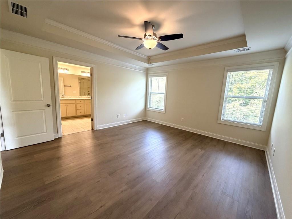 1980 Raven Way Chamblee, GA 30341 - Photo 19 of 51 a view of a livingroom with wooden floor and a ceiling fan