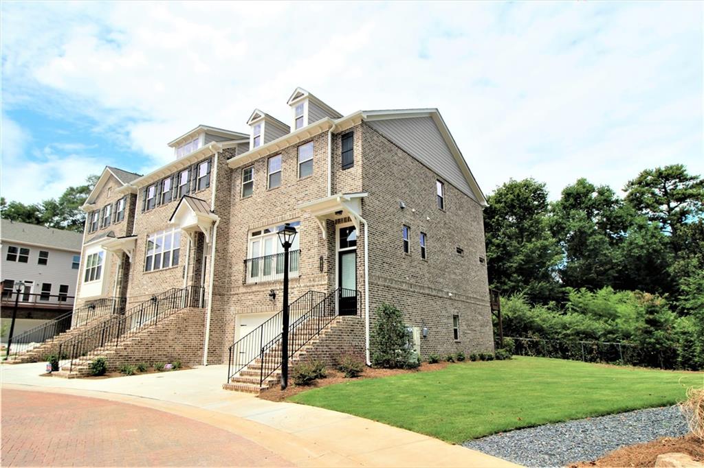 1980 Raven Way Chamblee, GA 30341 - Photo 2 of 51 a front view of a house with a yard