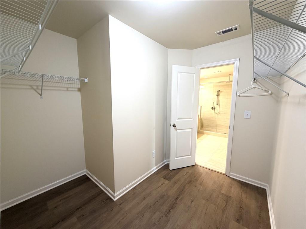 1980 Raven Way Chamblee, GA 30341 - Photo 25 of 51 a view of an empty room with wooden floor and a window