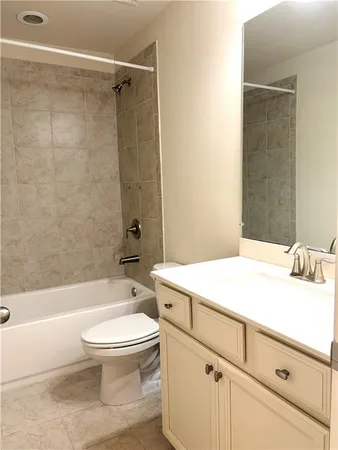 a bathroom with a sink a toilet and a bathtub