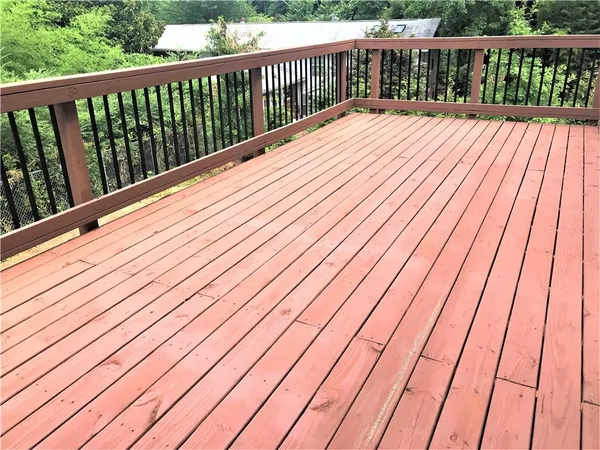 a balcony with wooden floor