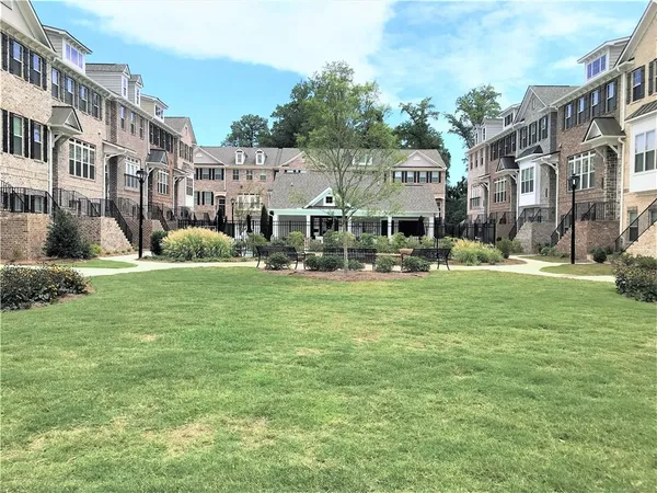 a front view of building with yard