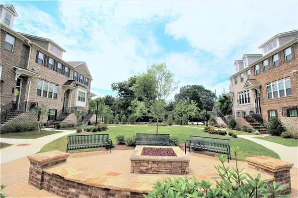 a swimming pool with outdoor seating and yard