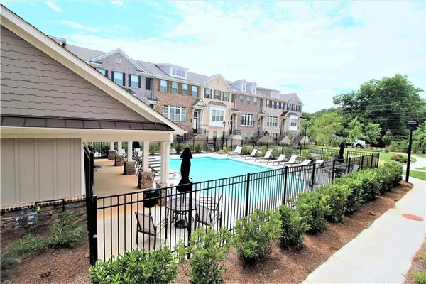 a front view of a house with swimming pool